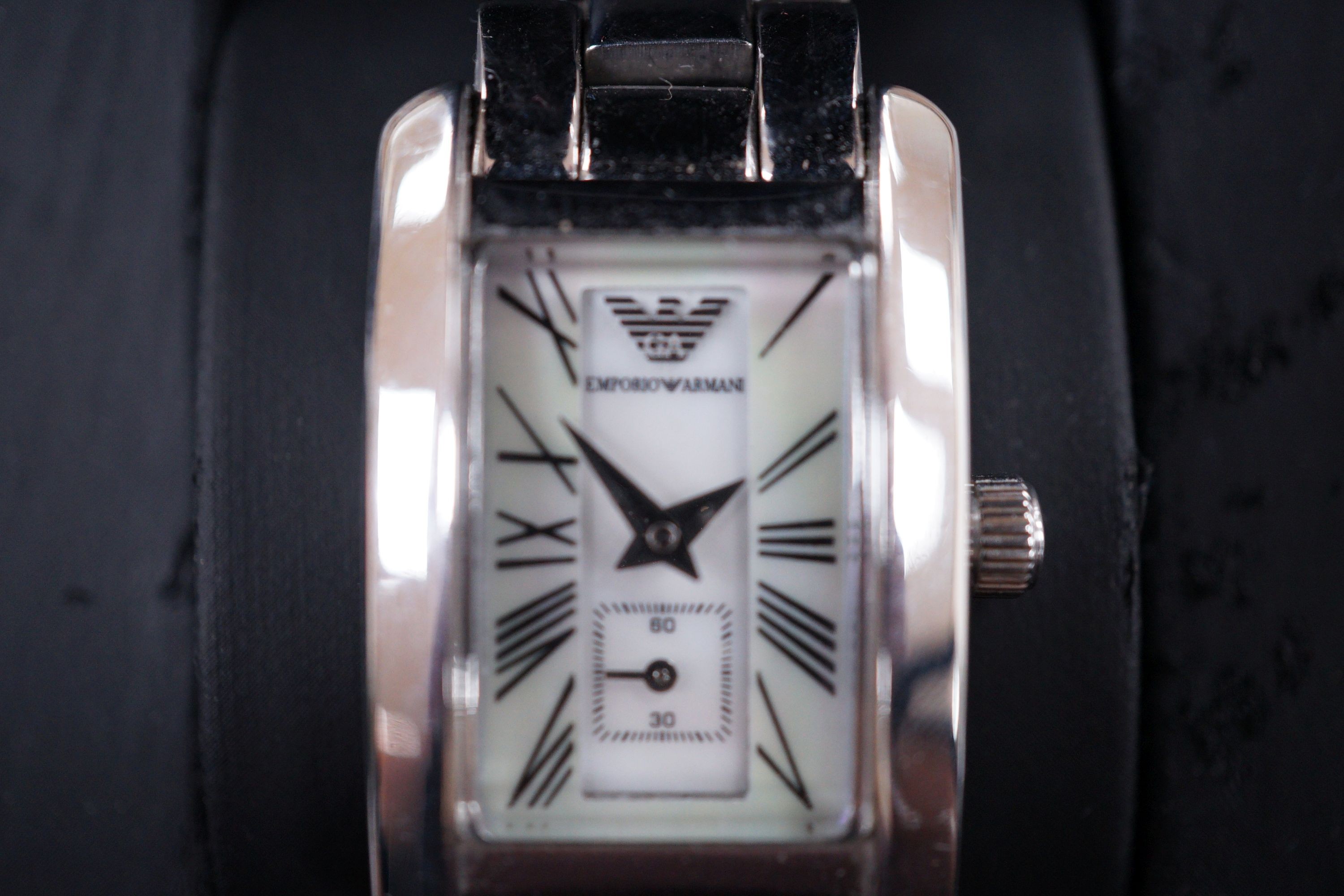 A lady's modern Emporio Armani quartz wrist watch, with mother of pearl dial and box.